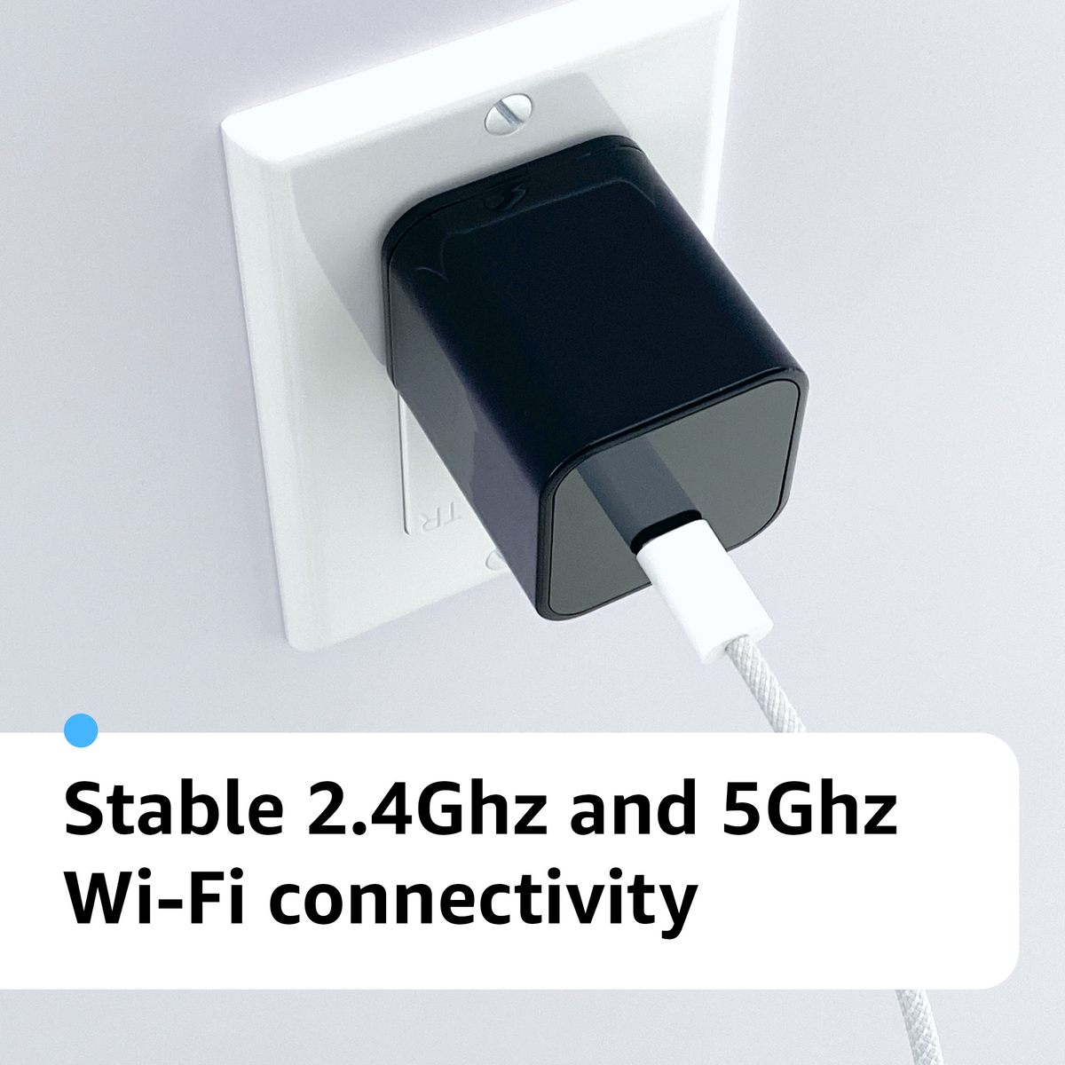 AlphaTech USB-C camera plugged into a wall outlet with a cable connected; supports 2.4 GHz and 5 GHz Wi-Fi.